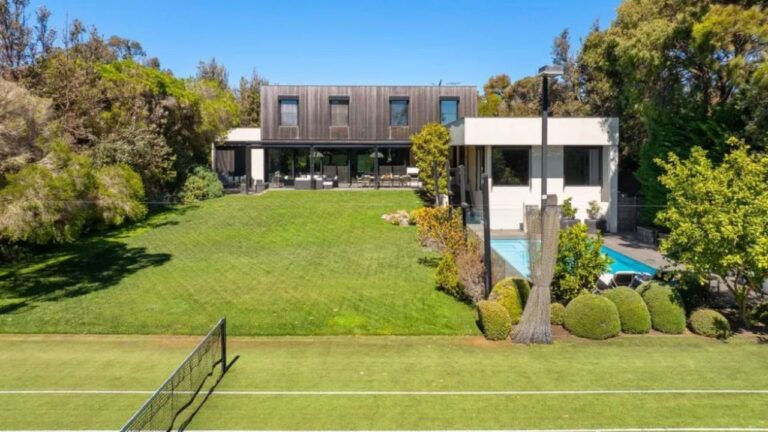 The sunlit backyard is complete with a pool and tennis court. Image realestate.com .au